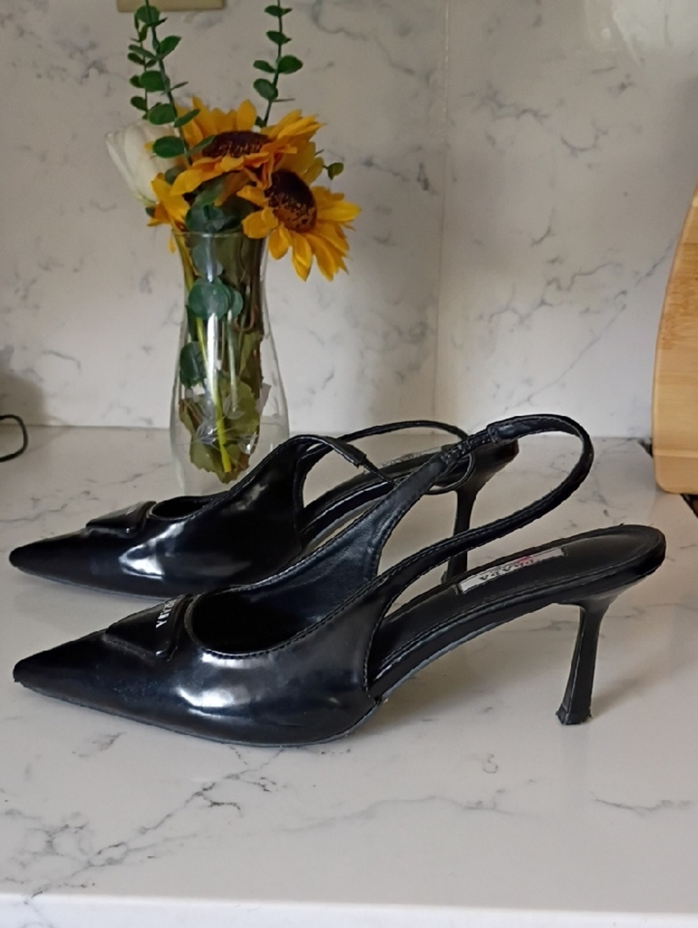 Black Pointed Slingback Pumps with Logo Accent